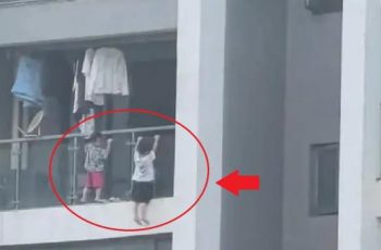 Bàng hoàng 2 bé trai leo ra ngoài ban công tầng 13, ‘đánh đu’ nguy hiểm